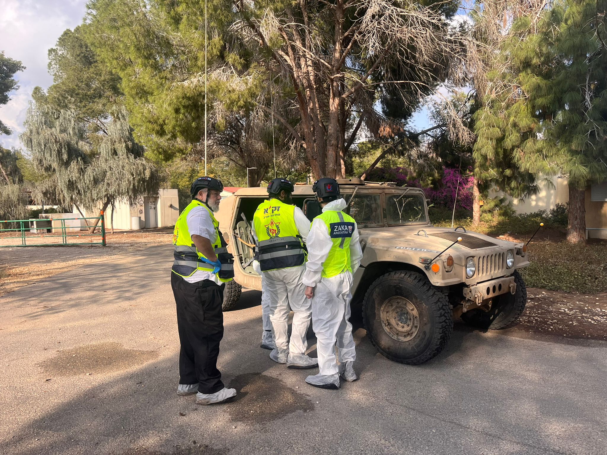 ZAKA volunteers coordinate with the army in the field.